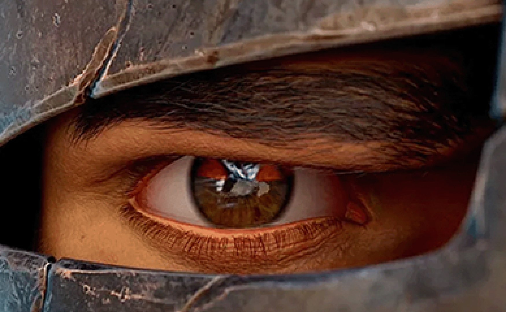 Eye of a warrior through a helmet